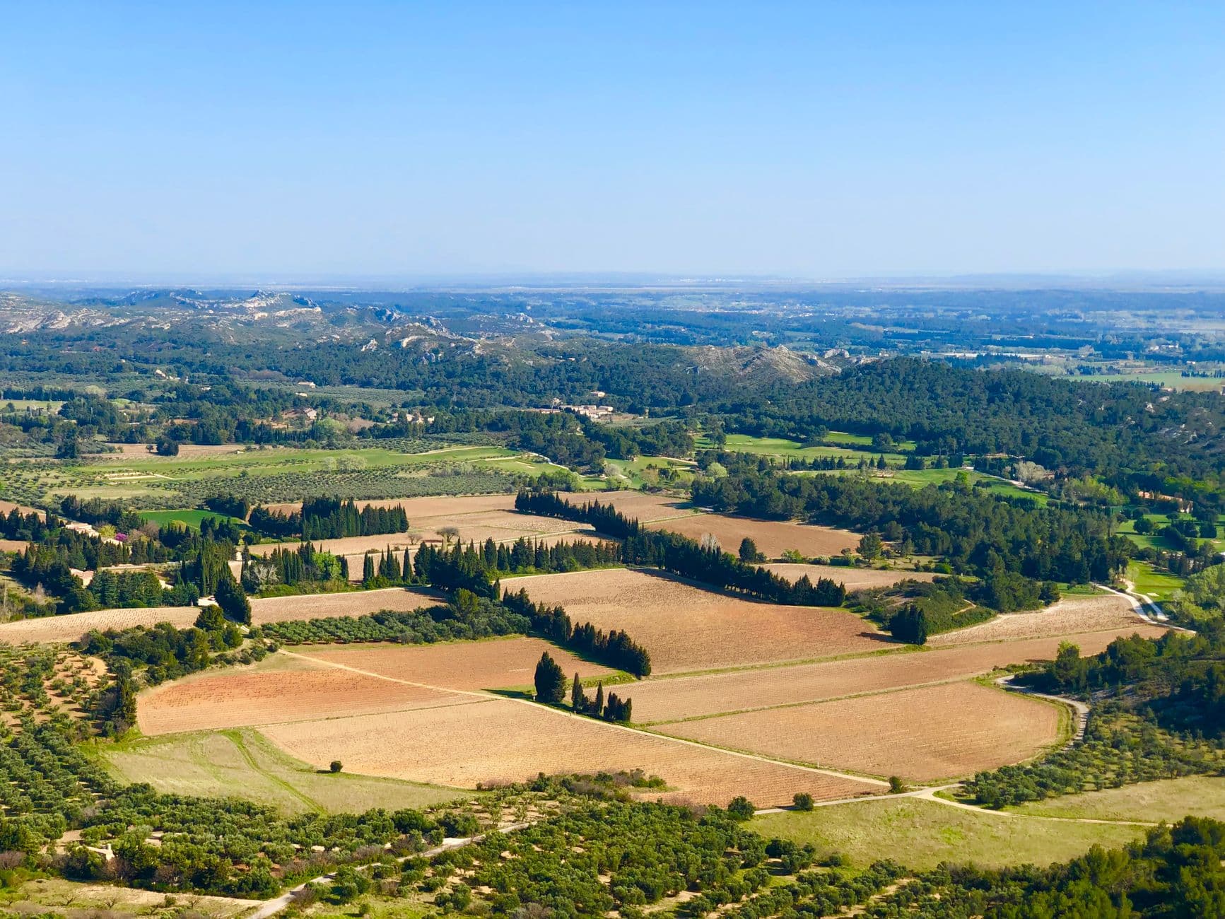 A scenic aerial view of the sprawling fields and lush hills in Provence, southern France.